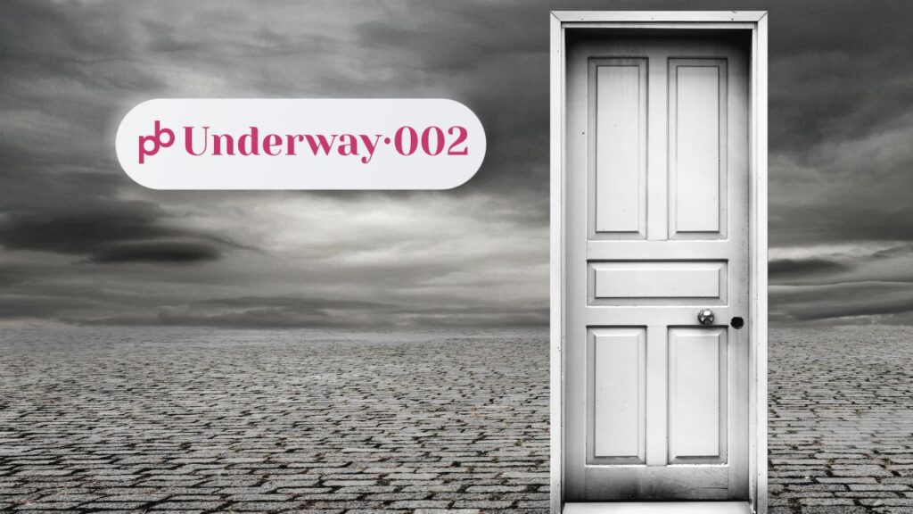 Underway 002 – self-publishing stigma: a single white door standing closed on empty cobblestones under a grey, clouded sky.